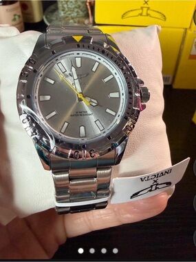 Invicta Silver Stainless Steel Watch with Yellow Accents